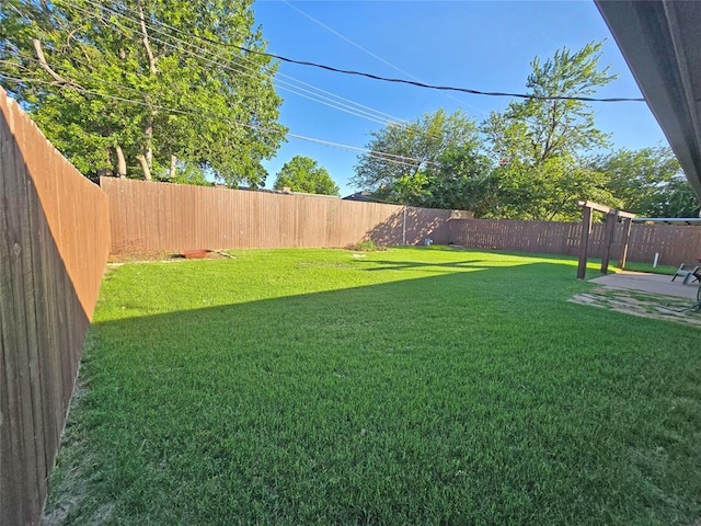 5712 Lawson Ln, Oklahoma City, OK 73132 - fenced backyard with a patio area