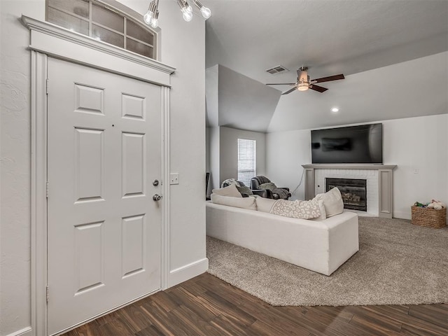 5112 NW 163rd St, Edmond, OK 73013 - living room with dark wood-type flooring, ceiling fan, and a tiled fireplace