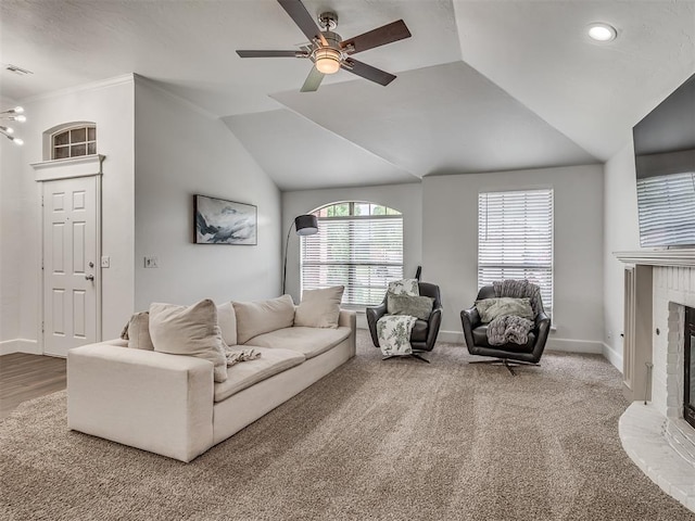 5112 NW 163rd St, Edmond, OK 73013 - carpeted living area with a fireplace, a ceiling fan, lofted ceiling, crown molding, and recessed lighting