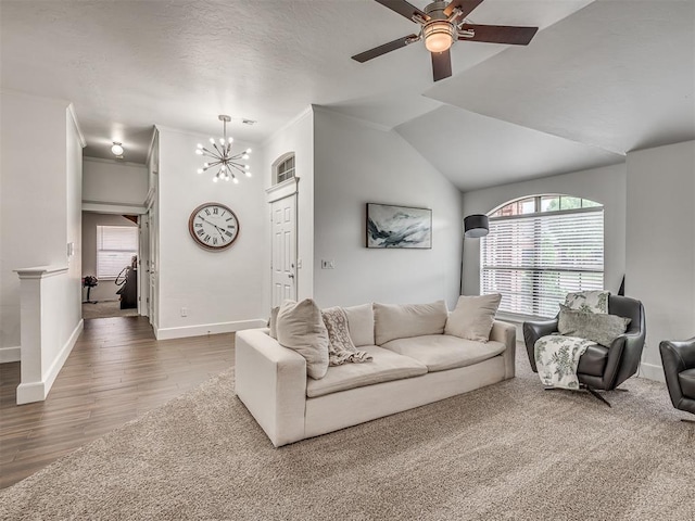 5112 NW 163rd St, Edmond, OK 73013 - living room with a chandelier, ceiling fan, wood finished floors, and lofted ceiling