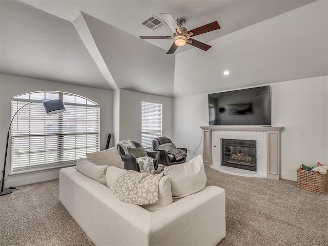 5112 NW 163rd St, Edmond, OK 73013 - carpeted living room with a ceiling fan, a brick fireplace, lofted ceiling, and recessed lighting