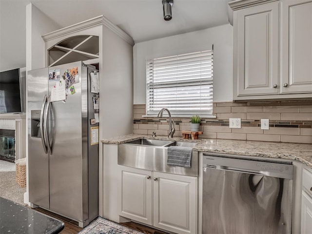 5112 NW 163rd St, Edmond, OK 73013 - kitchen featuring stainless steel appliances, tasteful backsplash, and light stone countertops