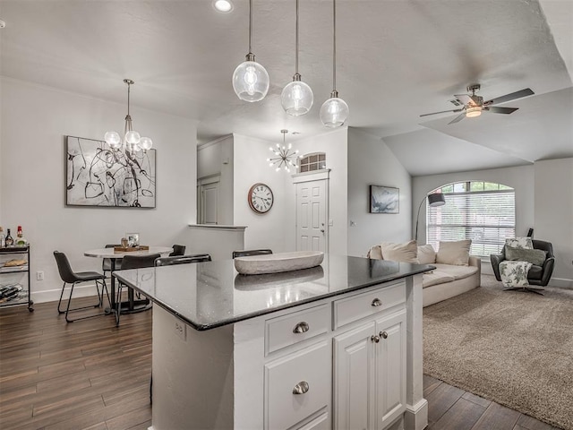 5112 NW 163rd St, Edmond, OK 73013 - kitchen featuring a chandelier, a kitchen island, open floor plan, white cabinetry, and lofted ceiling