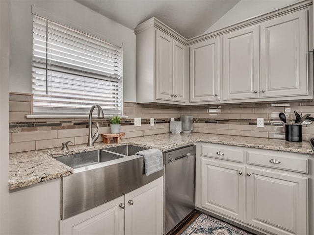 5112 NW 163rd St, Edmond, OK 73013 - kitchen featuring dishwasher, backsplash, vaulted ceiling, and light stone counters