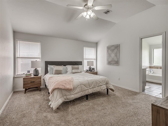 5112 NW 163rd St, Edmond, OK 73013 - bedroom with carpet flooring, vaulted ceiling, connected bathroom, and a ceiling fan