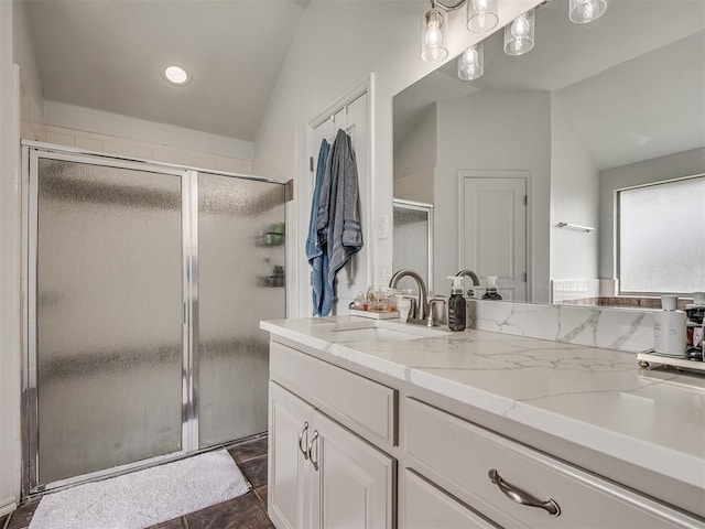5112 NW 163rd St, Edmond, OK 73013 - bathroom with vaulted ceiling, vanity, a shower stall, and recessed lighting