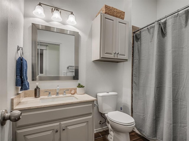 5112 NW 163rd St, Edmond, OK 73013 - bathroom with vanity, a shower with shower curtain, and wood finished floors