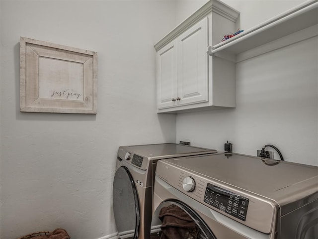 5112 NW 163rd St, Edmond, OK 73013 - laundry area with cabinet space and washing machine and clothes dryer