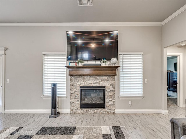 917 NE 34th Ter, Moore, OK 73160 - living area with wood finished floors, crown molding, and a fireplace