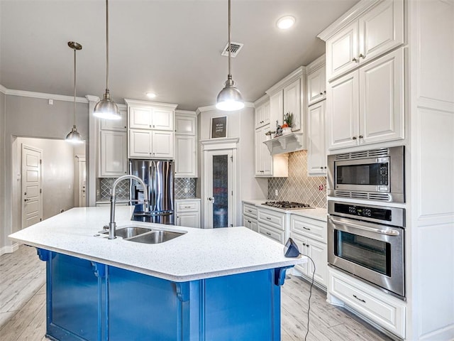 917 NE 34th Ter, Moore, OK 73160 - kitchen featuring stainless steel appliances, white cabinets, a breakfast bar area, tasteful backsplash, and recessed lighting