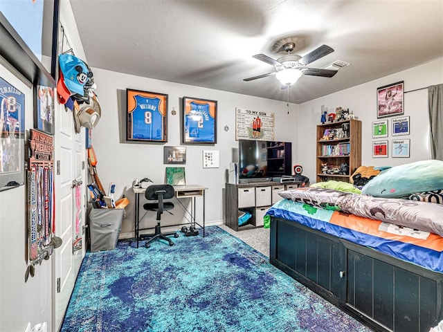 917 NE 34th Ter, Moore, OK 73160 - bedroom with carpet flooring, ceiling fan, and an office area