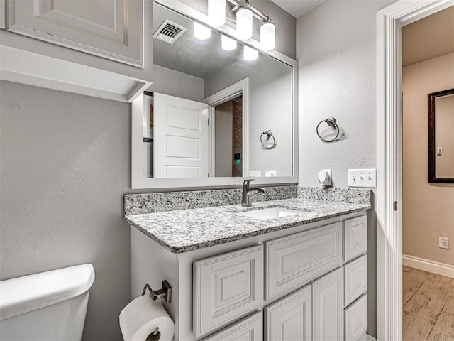 917 NE 34th Ter, Moore, OK 73160 - bathroom with vanity and wood finished floors