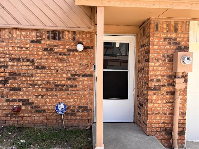 8300 NW 10th St Unit 140, Oklahoma City, OK 73127 - doorway to property featuring brick siding