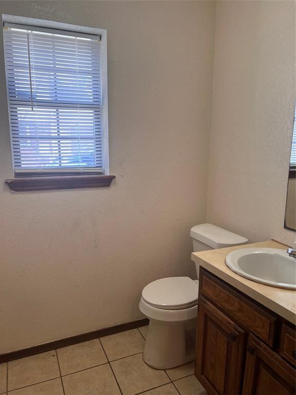 8300 NW 10th St Unit 140, Oklahoma City, OK 73127 - half bathroom featuring vanity and tile patterned floors