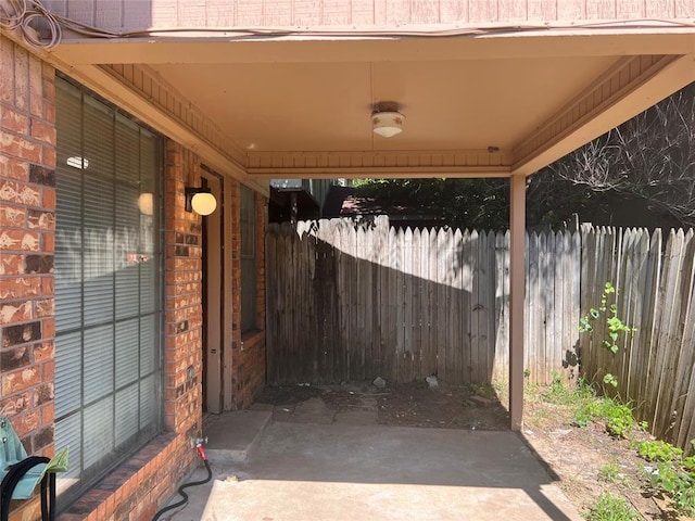 8300 NW 10th St Unit 140, Oklahoma City, OK 73127 - view of patio featuring a carport
