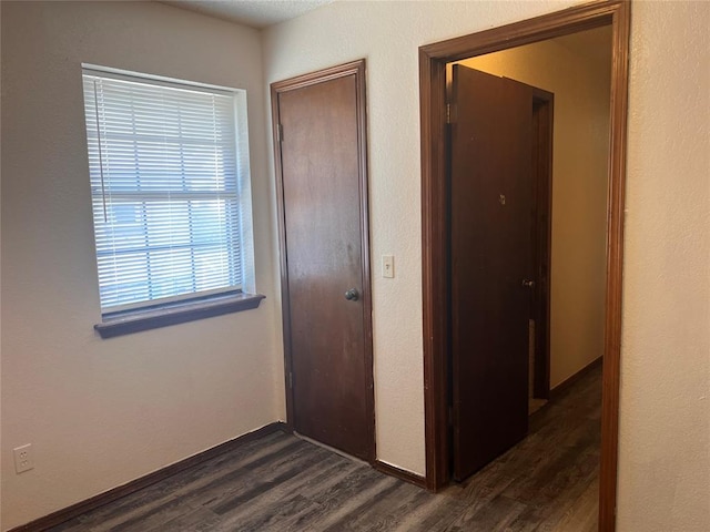 8300 NW 10th St Unit 140, Oklahoma City, OK 73127 - corridor with dark wood-type flooring
