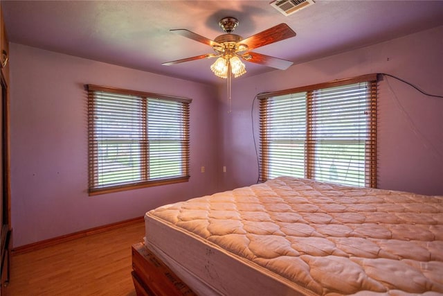 423 N Missouri St, Weatherford, OK 73669 - bedroom featuring wood finished floors and ceiling fan