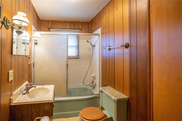 423 N Missouri St, Weatherford, OK 73669 - bathroom with vanity, bath / shower combo with glass door, and wooden walls