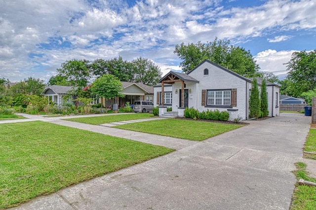 1621 NW 18th St, Oklahoma City, OK 73106 - bungalow-style home with concrete driveway and brick siding
