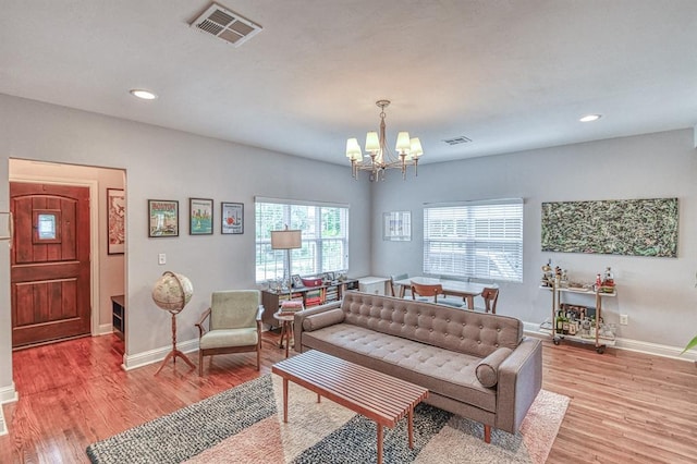 1621 NW 18th St, Oklahoma City, OK 73106 - living room featuring a chandelier, light wood-style floors, and recessed lighting