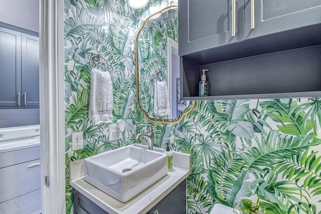 1621 NW 18th St, Oklahoma City, OK 73106 - bathroom with wallpapered walls, vanity, and washer / dryer