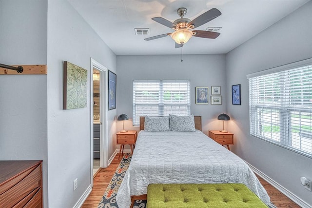 1621 NW 18th St, Oklahoma City, OK 73106 - bedroom with light wood-style floors, a ceiling fan, and ensuite bath
