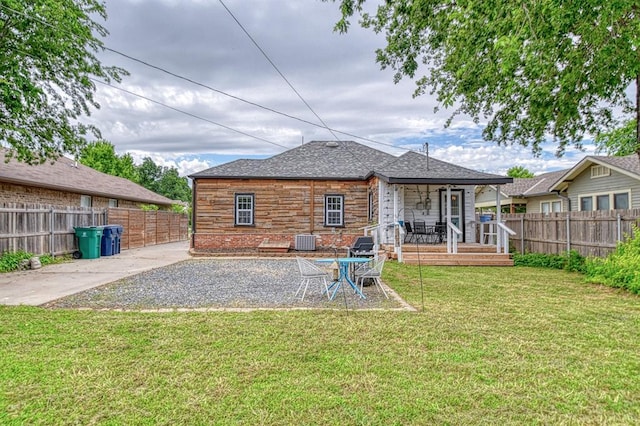 1621 NW 18th St, Oklahoma City, OK 73106 - rear view of property with a fenced backyard and a patio