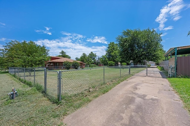 4504 N Grove Ave, Warr Acres, OK 73122 - view of yard with a gate and driveway