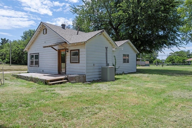 4504 N Grove Ave, Warr Acres, OK 73122 - back of house with a shingled roof and a deck