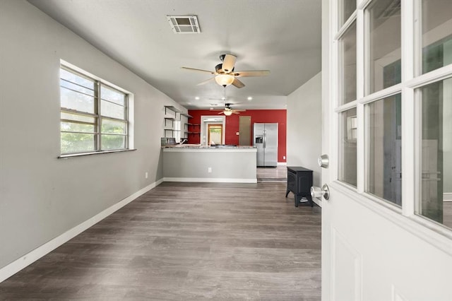 4504 N Grove Ave, Warr Acres, OK 73122 - unfurnished living room featuring a ceiling fan and wood finished floors