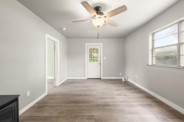 4504 N Grove Ave, Warr Acres, OK 73122 - unfurnished room with ceiling fan and wood finished floors