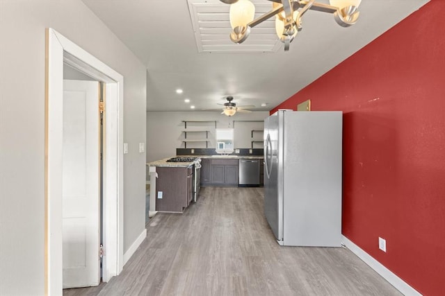 4504 N Grove Ave, Warr Acres, OK 73122 - kitchen with freestanding refrigerator, dishwasher, light wood-type flooring, light countertops, and ceiling fan