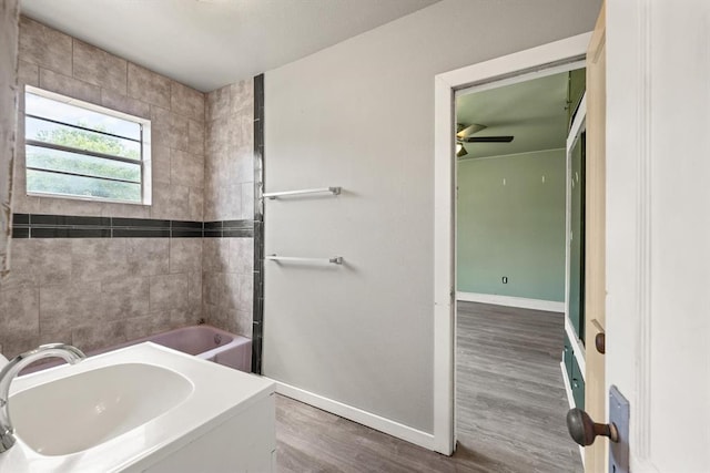 4504 N Grove Ave, Warr Acres, OK 73122 - bathroom featuring wood finished floors and a ceiling fan