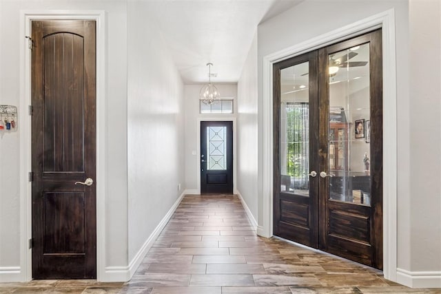 12505 Shady Gln, Choctaw, OK 73020 - entryway with a chandelier, french doors, and wood finished floors