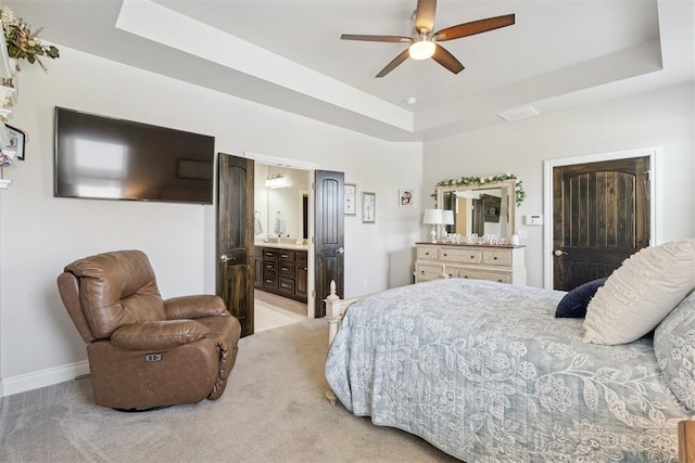 12505 Shady Gln, Choctaw, OK 73020 - bedroom featuring a tray ceiling, light colored carpet, and ensuite bath