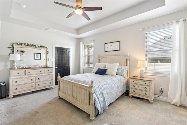 12505 Shady Gln, Choctaw, OK 73020 - bedroom with a raised ceiling, light carpet, and ceiling fan