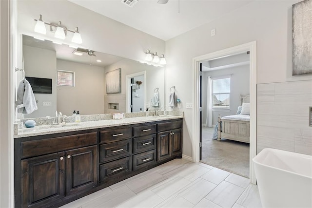12505 Shady Gln, Choctaw, OK 73020 - full bath featuring connected bathroom, double vanity, a freestanding bath, and ceiling fan