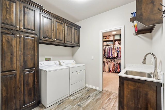 12505 Shady Gln, Choctaw, OK 73020 - laundry room with independent washer and dryer, cabinet space, and light wood-style floors