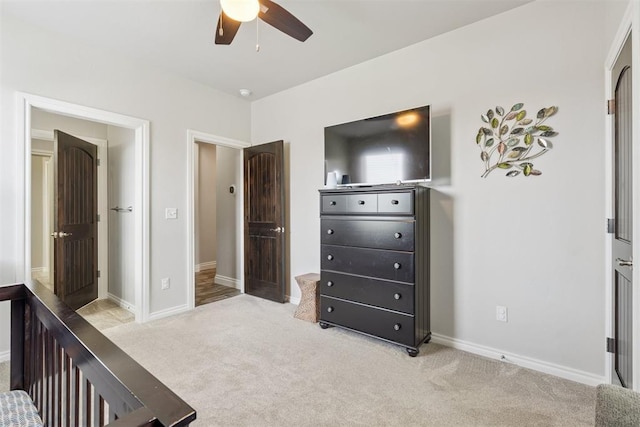 12505 Shady Gln, Choctaw, OK 73020 - carpeted bedroom featuring baseboards and a ceiling fan