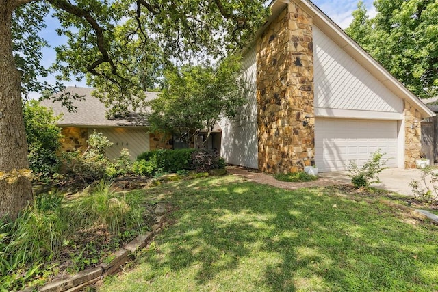 2416 Chimney Hill Ct, Edmond, OK 73034 - view of side of property with a lawn, stone siding, and concrete driveway