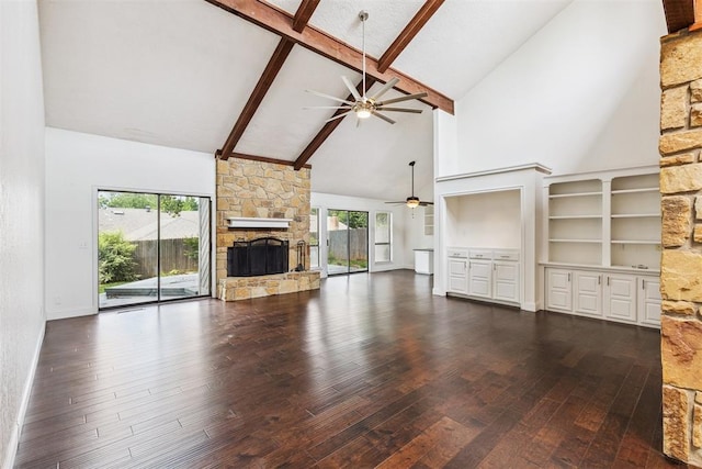 2416 Chimney Hill Ct, Edmond, OK 73034 - unfurnished living room with ceiling fan, high vaulted ceiling, a stone fireplace, dark wood-style floors, and plenty of natural light