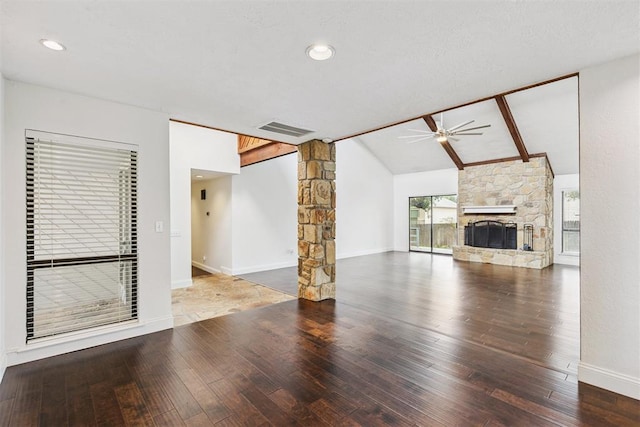 2416 Chimney Hill Ct, Edmond, OK 73034 - unfurnished living room with a ceiling fan, wood-type flooring, lofted ceiling, decorative columns, and a fireplace