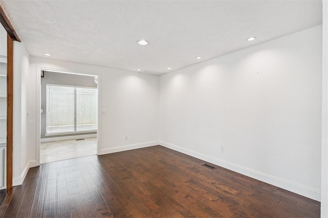 2416 Chimney Hill Ct, Edmond, OK 73034 - unfurnished room featuring dark wood-style floors and recessed lighting