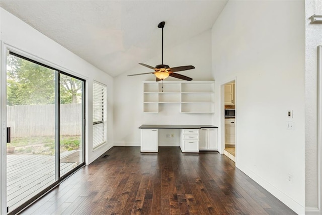 2416 Chimney Hill Ct, Edmond, OK 73034 - unfurnished office featuring dark wood-style flooring, ceiling fan, built in desk, and high vaulted ceiling