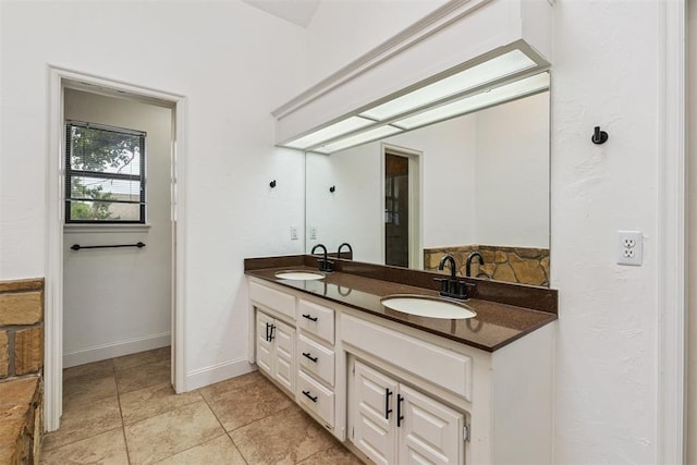 2416 Chimney Hill Ct, Edmond, OK 73034 - full bathroom with double vanity and baseboards