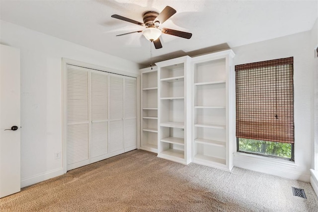 2416 Chimney Hill Ct, Edmond, OK 73034 - unfurnished bedroom featuring carpet, a closet, and ceiling fan