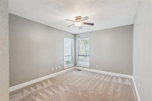 2416 Chimney Hill Ct, Edmond, OK 73034 - carpeted spare room with a ceiling fan, a textured ceiling, and a textured wall