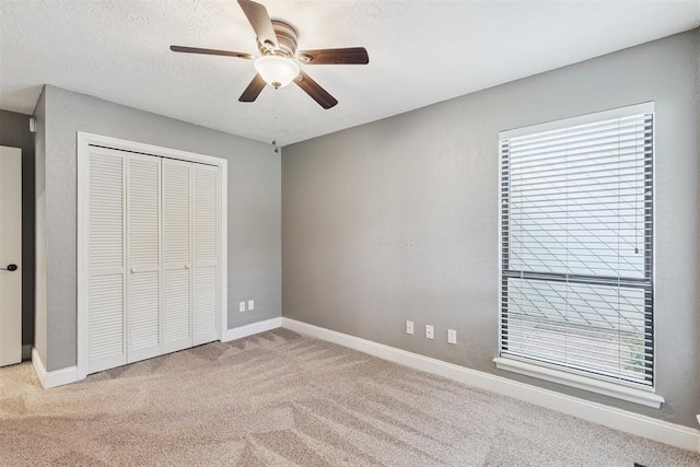 2416 Chimney Hill Ct, Edmond, OK 73034 - unfurnished bedroom with carpet flooring, multiple windows, and a closet