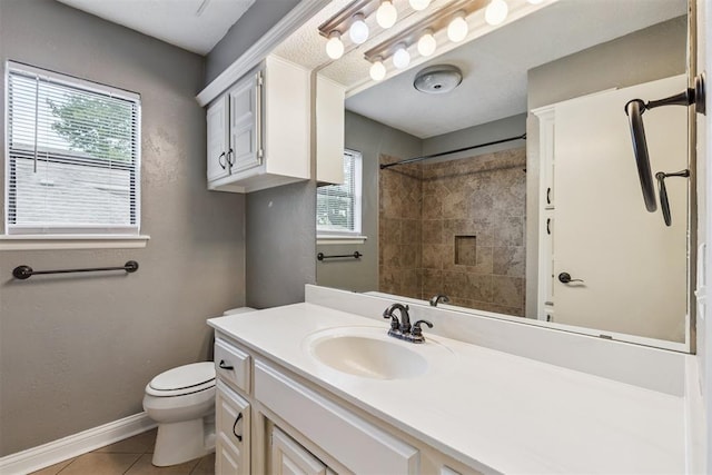 2416 Chimney Hill Ct, Edmond, OK 73034 - full bath with tile patterned floors, vanity, healthy amount of natural light, and a shower
