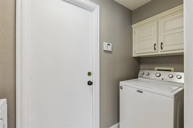 2416 Chimney Hill Ct, Edmond, OK 73034 - washroom featuring washer / clothes dryer, cabinet space, and a textured wall